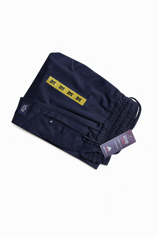 "Folded navy blue Tommy Hilfiger inspired men's stretchable trousers with tags"